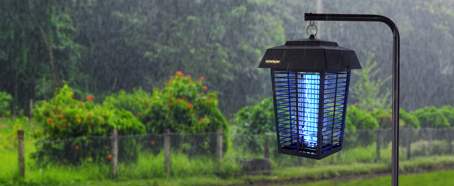 Bug zapper with bright blue light outside in rainy weather